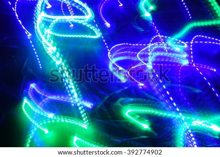 Chaotic lights in moriol blur out of focus - abstract photograph background.