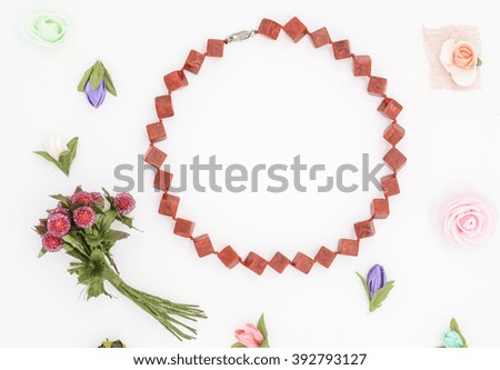 beads and flowers on white