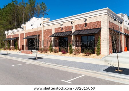Small commercial retail building Royalty-Free Stock Photo #392815069