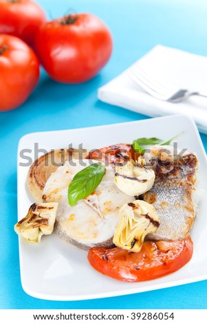 fresh slice of hake baked with vegetables