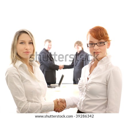 Business picture illustrating female handshake in front and male handshake behind