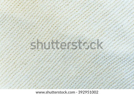 beige wool knitted fabric with patterns closeup