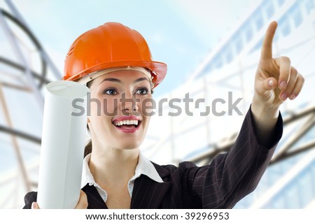 a beautiful young architector in a hardhat