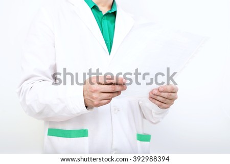 doctor in lab coat, medical gown, nurse with the documents of the patient card, diagnosis