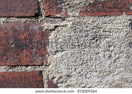 Close Up of an Old Exterior Brick Wall with Concrete