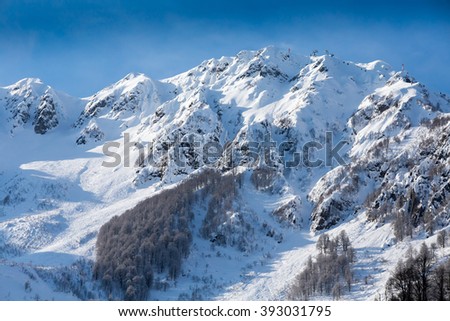top view to Caucasian mountains peaks covered by snow 