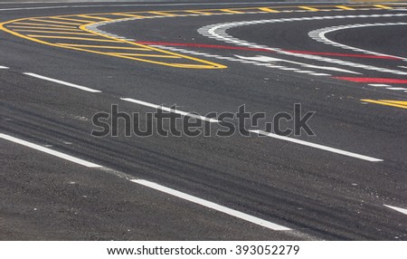 Asphalt road with dividing lines and tire tracks. Background photo texture