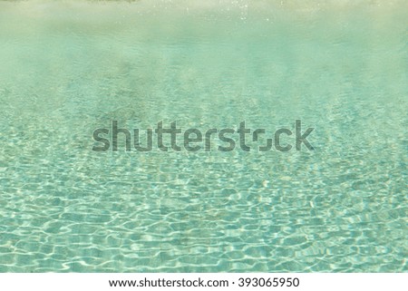 Green swimming pool rippled water detail