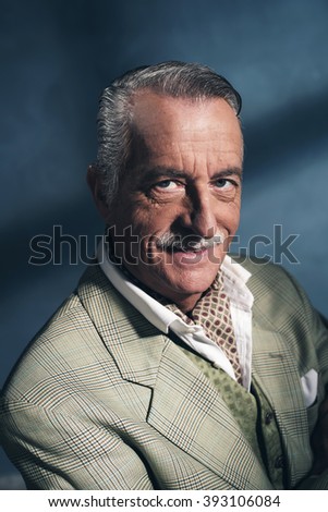 Retro 1940 senior business man. Little smile. Studio shot.