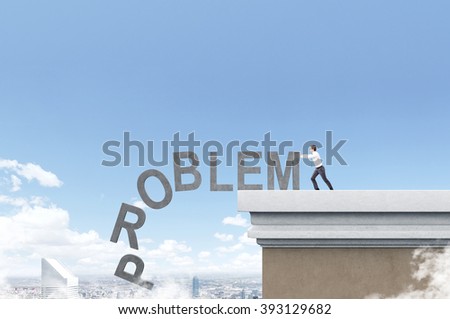 Businessman pushing letters of word 'problem' from roof. Blue sky and Paris at background. Concept of coping with problem.