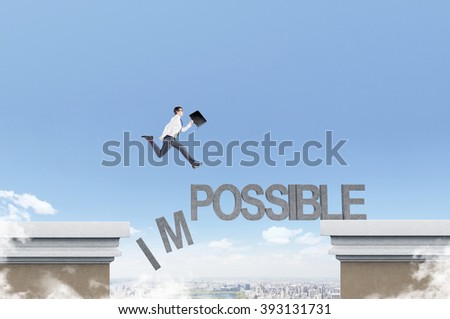 Businessman running over word 'impossible' between two roof,  letters I and M falling down. Blue sky at background. Concept of opportunity.