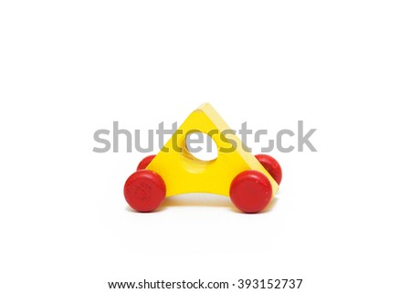 Triangle shaped wooden yellow toy car isolated on white background. Basic geometric shaped car for children education.