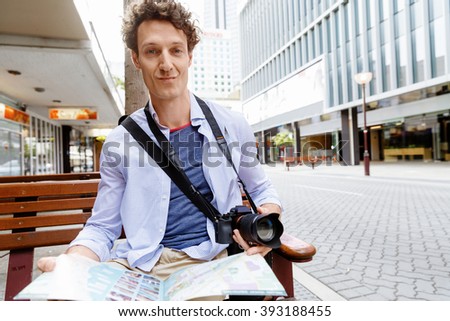 Male tourist in city