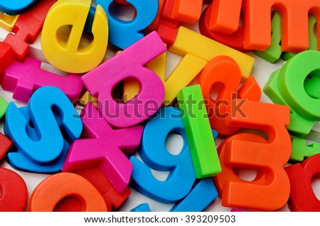 Colorful letters on background closeup
