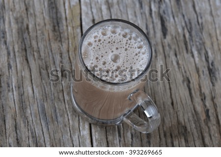 Coffee glass top view on old wooden