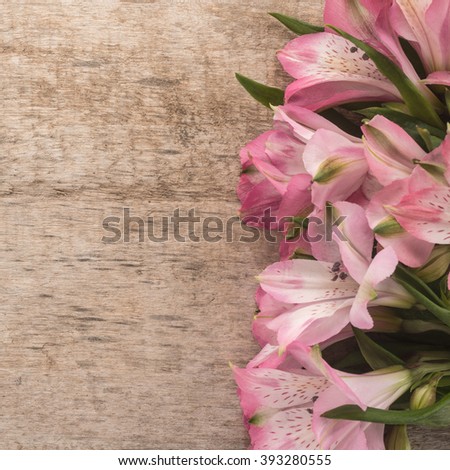 Alstroemeria Flowers on wooden background 
