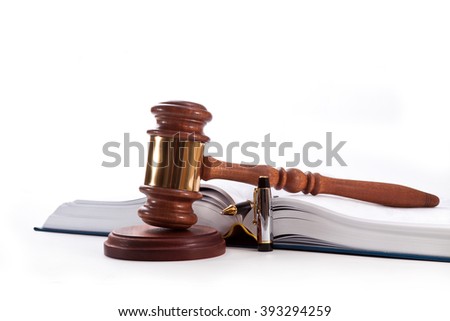 Gavel, book and pen on a white background