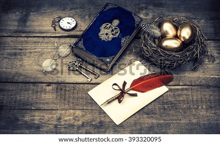 Golden easter eggs and antique bible book. Vintage style toned picture