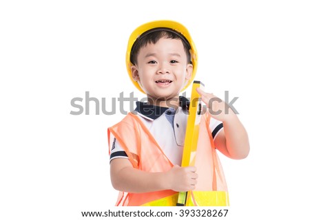 Asian boy pretending to be a construction worker. Isolated over white background.