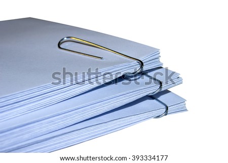 A stack of envelopes with paper clips on white background office supplies