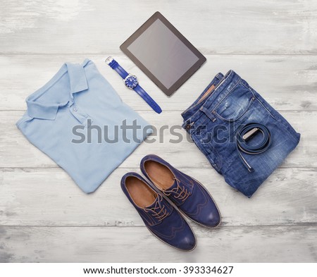Man's clothing, watch and tablet