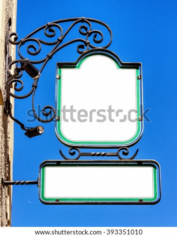 beautiful old store sign in front of sky