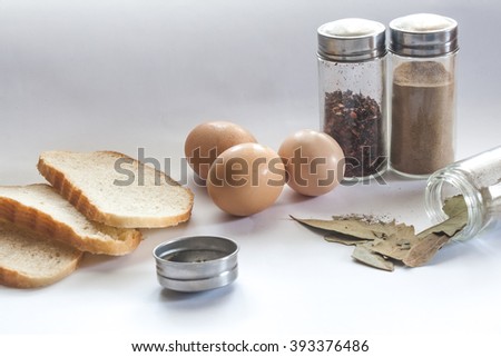 Bread seasoning and eggs on the sunny kitchen