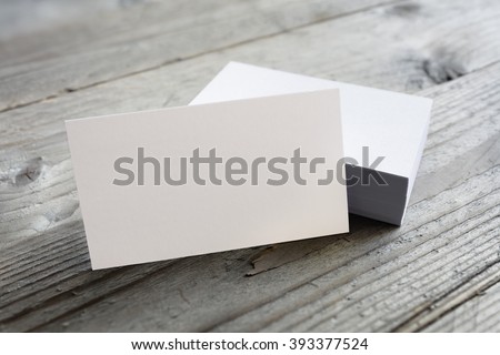 Business cards blank mockup on wooden background Royalty-Free Stock Photo #393377524