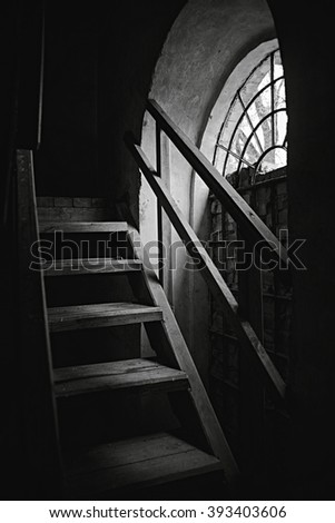 Contrast light from a window on stairs. Old building. Ukraine