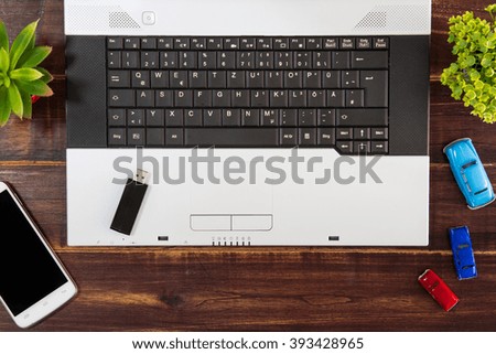 Notebook computer on the desk,USB flash drive stick,smartphone