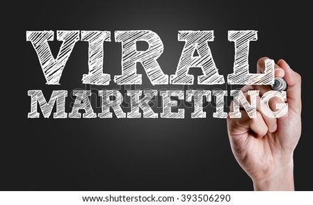 Hand writing the text: Viral Marketing