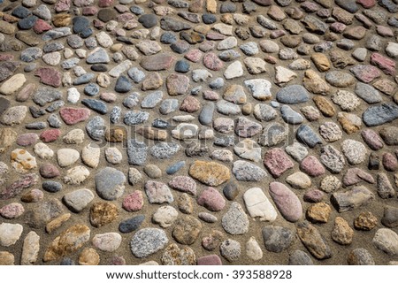 pavement from sea stones - texture. Abstract structured background.