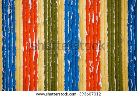 Structural colorful background made out of torn paper strips