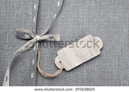 Grey fabric background with ribbon 