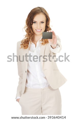 Businesswoman holding blank card.