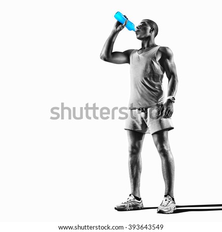 Young muscular build man silhouette drinking water of bottle after running, attractive athlete resting after workout outdoors, fitness and healthy lifestyle concept. Isolated on white Royalty-Free Stock Photo #393643549