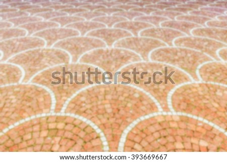 Defocused background of Sampietrini cobblestone pavement in Rome, Italy. Intentionally blurred post production for bokeh effect
