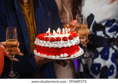 Happy birthday! Group people holding cake.