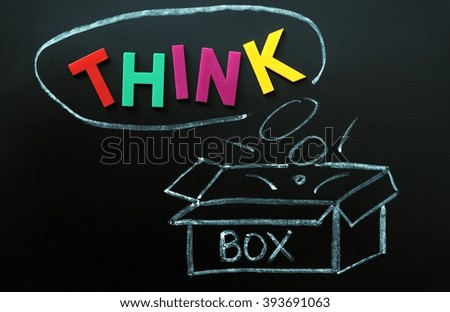 Think outside the box concept made of colorful letters and chalk drawing