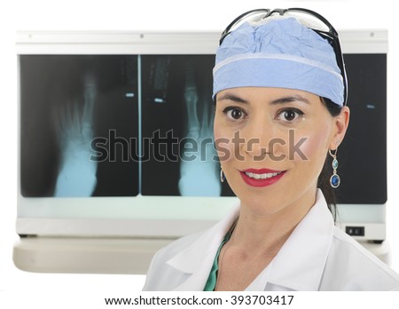 Close-up of a  beautiful female surgeon standing before her lightbox displaying foot x-rays.  On a white background.