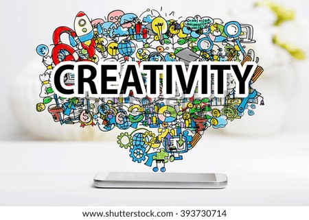 Creativity concept with smartphone on white table