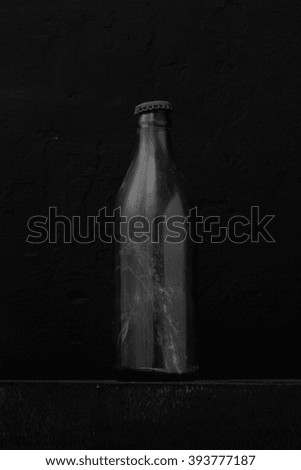An old bottle on black background
