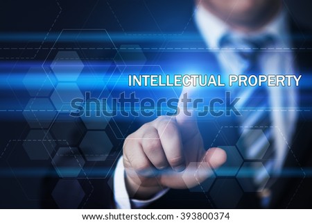 business, technology, internet and virtual reality concept - businessman pressing intellectual property button on virtual screens with hexagons and transparent honeycomb