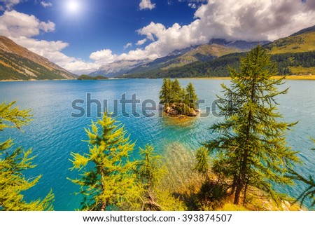 Fantastic view on turquoise water Silsersee lake (Sils) including Piz Corvatsch in the Swiss Alps. Location famous resort Upper Engadine valley, Canton Grisons, Europe. Artistic scene. Beauty world.