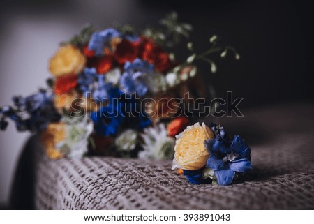 Wedding Bouquet with boutonniere on brown cloth bad with tape