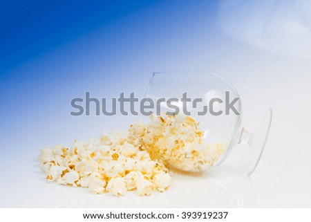  large glass of popcorn on a blue background