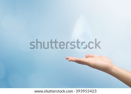 human hand showing water drop with global inside for world water day concept for safe life:Elements of this image furnished by NASA.