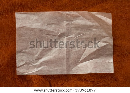 the transparent thin paper on leather background Royalty-Free Stock Photo #393961897