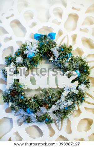 green christmas wreath with decorations isolated on white background