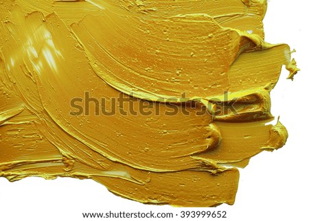 yellow  brush strokes of oil paint on the palette